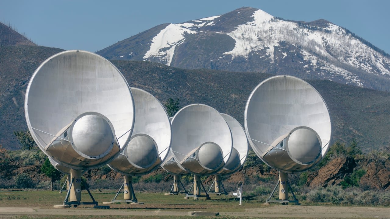 A group of large telescopes pointed towards the sky