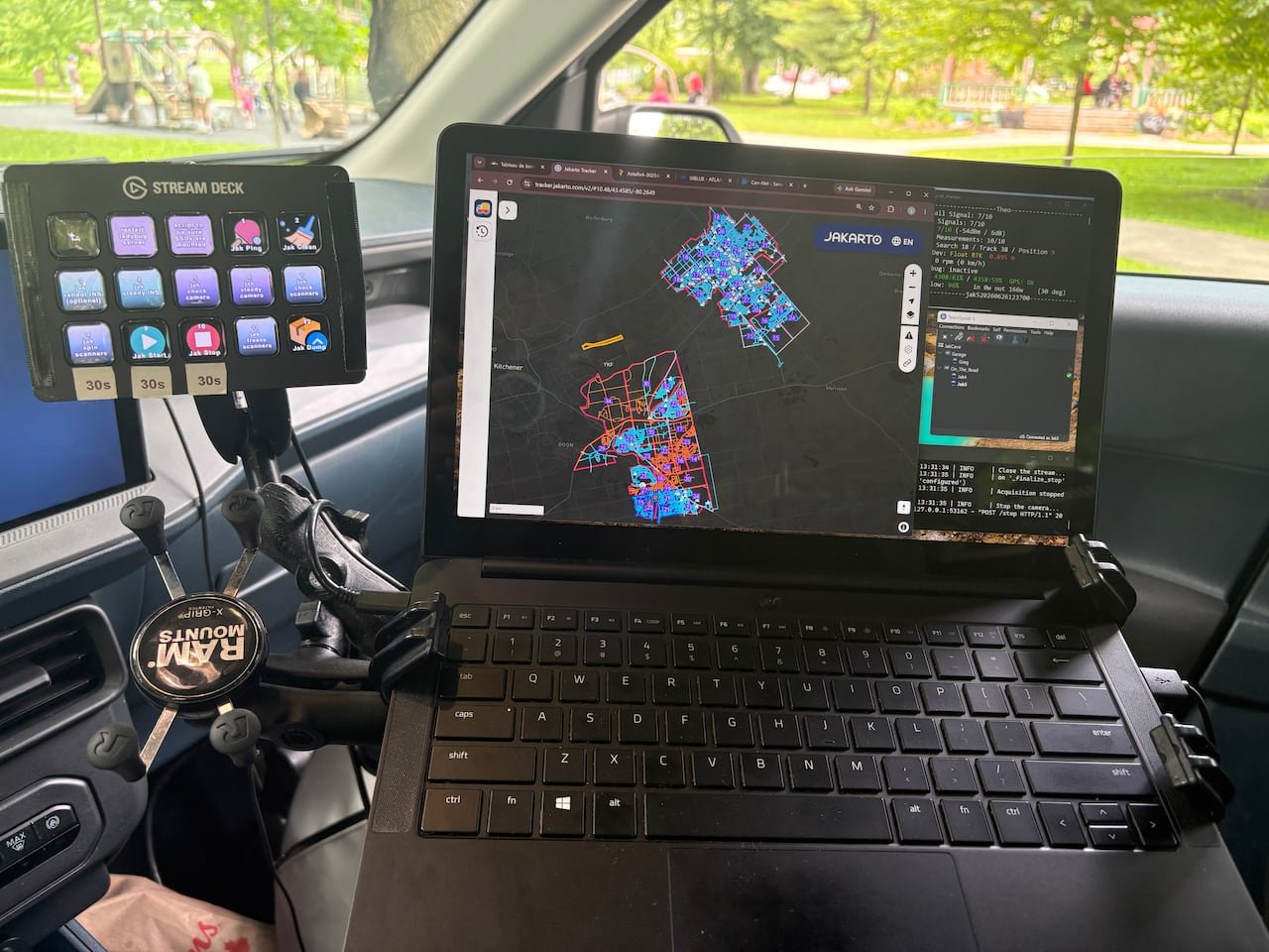 Photo of a computer screen in car showing maps of cities.